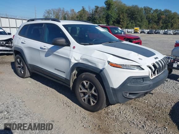 ✅ 2014 Jeep Cherokee Trailhawk • VIN: 1C4PJMBS9EW239763 • Lot: 43613520. Listed on IAAI with 122,929 mi. Free auction sales archive from the USA and detailed vehicle history report at DreamBid. Image 1.