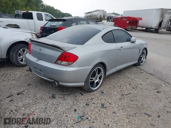 ✅ 2005 Hyundai Tiburon GS • VIN: KMHHM65D85U174335 • Лот: 39373771. Опубликован ранее на IAAI с пробегом 117 296 миль. Бесплатный доступ к архиву аукционных продаж из США и подробный отчёт об истории автомобиля на DreamBid. Изображение 4.