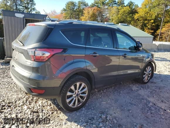 2017 Ford Escape Titanium с VIN 1FMCU9J98HUC40710, выставлен на аукционе Copart как лот 82381355 с пробегом 124 333 миль миль и Списание • Salvage title. История ставок и продаж доступна на DreamBid. Изображение 3.