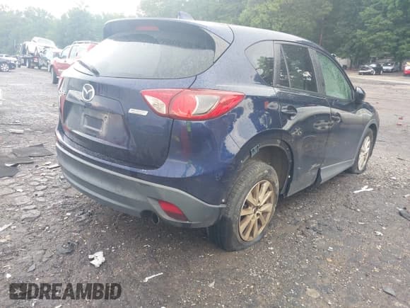 ✅ 2013 Mazda CX-5 Touring • VIN: JM3KE2CE1D0132257 • Lot: 42700625. Listed on IAAI with 87,796 mi. Free auction sales archive from the USA and detailed vehicle history report at DreamBid. Image 4.