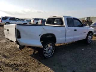 2001 Dodge Dakota with VIN 1B7FL22P01S324076, listed as a Copart auction lot 68478854 with 263,846 mi miles and Salvage title. Bid and sale history available at DreamBid. Image 3.