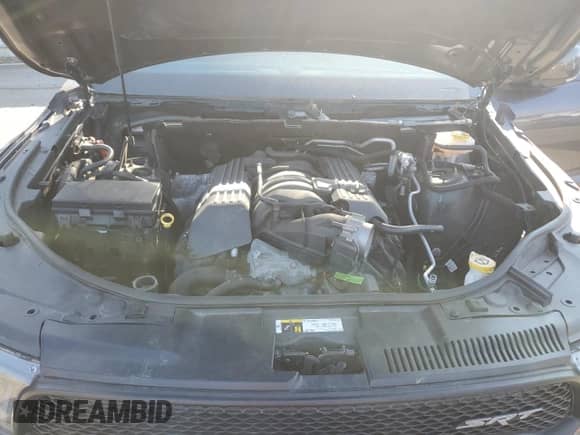 2018 Dodge Durango SRT z VIN 1C4SDJGJ2JC169843, wystawiony jako Copart lot #71884965 z przebiegiem Nie podano mil oraz Czysty tytuł • Clean title. Historia ofert i sprzedaży dostępna na DreamBid. Obrazek 12.