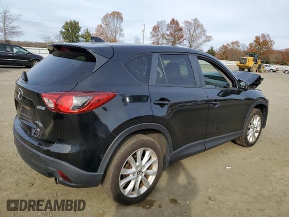 ✅ 2014 Mazda CX-5 Grand Touring • VIN: JM3KE4DY7E0311084 • Лот: 91661595. Опубликован ранее на Copart с пробегом 176 490 миль. Бесплатный доступ к архиву аукционных продаж из США и подробный отчёт об истории автомобиля на DreamBid. Изображение 3.