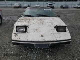 ✅ 1984 Pontiac Fiero • VIN: 1G2AF37R6EP320306 • Lot: 68255394. Wystawiony na Copart z przebiegiem 49 284 mil. Bezpłatny archiwum sprzedaży aukcyjnych z USA i szczegółowy raport historii pojazdu na DreamBid. Zdjęcie 5.