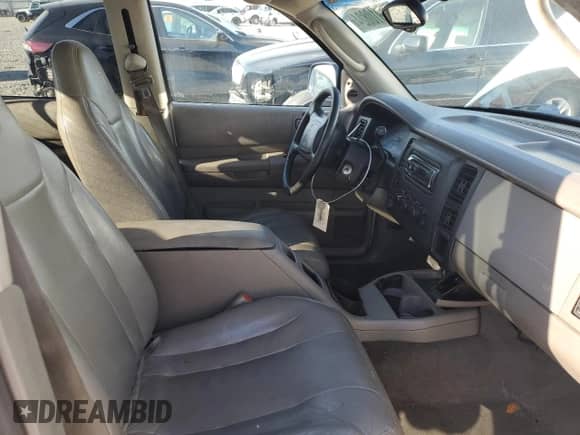 2001 Dodge Dakota Sport z VIN 1B7HG2AN71S260163, wystawiony jako Copart lot #68867304 z przebiegiem 250 426 mil mil oraz Szkoda całkowita • Salvage title. Historia ofert i sprzedaży dostępna na DreamBid. Obrazek 7.