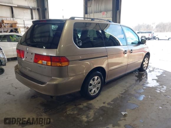 ✅ 2004 Honda Odyssey EX-L • VIN: 5FNRL18794B074711 • Lot: 41333406. Listed on IAAI with 164,463 mi. Free auction sales archive from the USA and detailed vehicle history report at DreamBid. Image 4.