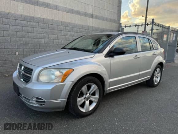 2010 Dodge Caliber SXT с VIN 1B3CB4HA1AD579409, выставлен на аукционе Copart как лот 60522605 с пробегом 100 311 миль миль и Чистый • Clean title. История ставок и продаж доступна на DreamBid. Изображение 2.