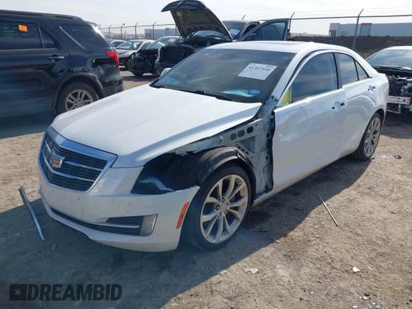 ✅ 2015 Cadillac ATS Performance RWD • VIN: 1G6AC5SX4F0113027 • Лот: 41307410. Опубликован ранее на IAAI с пробегом 125 336 миль. Бесплатный доступ к архиву аукционных продаж из США и подробный отчёт об истории автомобиля на DreamBid. Изображение 2.