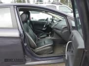 ✅ 2013 Ford Fiesta Titanium • VIN: 3FADP4FJ3DM208483 • Lot: 43900854. Wystawiony na IAAI z przebiegiem 178 774 mil. Bezpłatny archiwum sprzedaży aukcyjnych z USA i szczegółowy raport historii pojazdu na DreamBid. Zdjęcie 5.