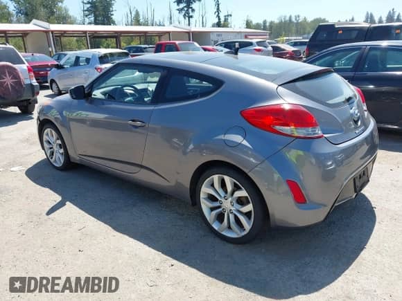 2012 Hyundai Veloster w/Black Int with VIN KMHTC6AD5CU030788, listed as a IAAI auction lot 42774337 with 104,297 mi miles and . Bid and sale history available at DreamBid. Image 3.