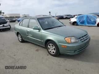 2004 Hyundai Accent GL z VIN KMHCG45C14U540938, wystawiony jako Copart lot #46701935 z przebiegiem 71 891 mil mil oraz Szkoda całkowita • Salvage title. Historia ofert i sprzedaży dostępna na DreamBid. Obrazek 4.
