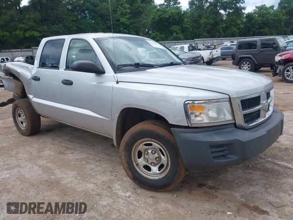 2009 Dodge Dakota ST z VIN 1D7HE28K59S792966, wystawiony jako IAAI lot #42224707 z przebiegiem 211 063 mil mil oraz . Historia ofert i sprzedaży dostępna na DreamBid. Obrazek 1.