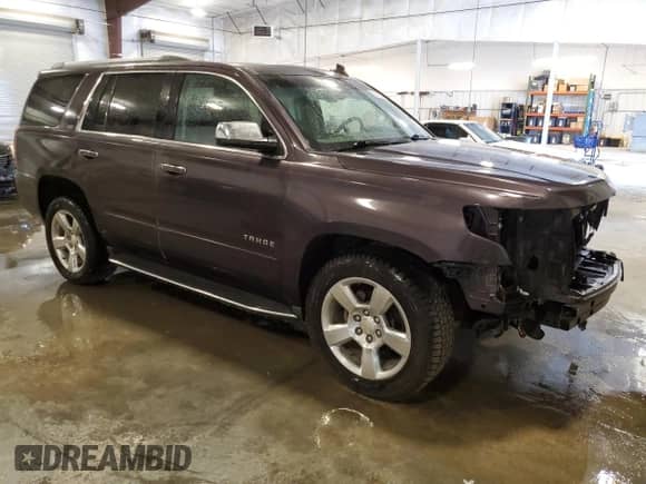 2016 Chevrolet Tahoe LTZ with VIN 1GNSKCKC5GR107425, listed as a Copart auction lot 81219225 with 130,322 mi miles and Salvage title. Bid and sale history available at DreamBid. Image 4.