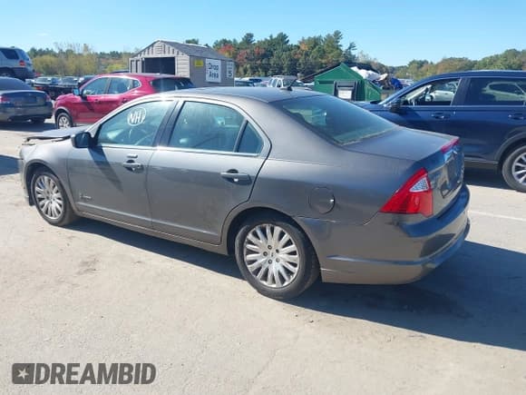 ✅ 2012 Ford Fusion Hybrid • VIN: 3FADP0L37CR221169 • Lot: 43415679. Listed on IAAI with 124,271 mi. Free auction sales archive from the USA and detailed vehicle history report at DreamBid. Image 3.