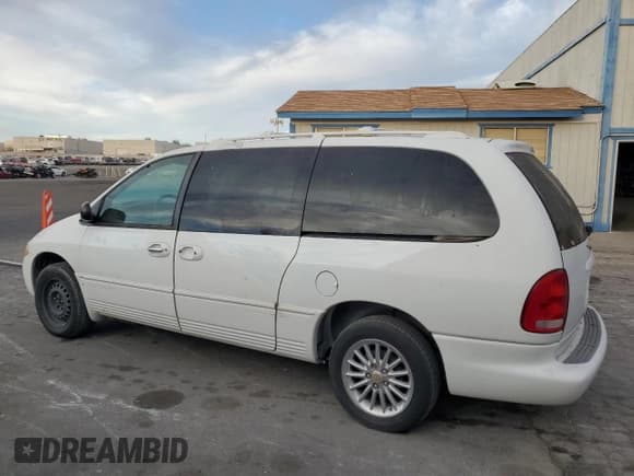 ✅ 2000 Chrysler Town & Country Limited • VIN: 1C4GP64L9YB521378 • Lot: 41983765. Listed on Copart with 74,216 mi. Free auction sales archive from the USA and detailed vehicle history report at DreamBid. Image 2.