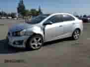 2014 Chevrolet Sonic LTZ с VIN 1G1JE5SG1E4128009, выставлен на аукционе Copart как лот 54007785 с пробегом 146 811 миль миль и Списание • Salvage title. История ставок и продаж доступна на DreamBid. Изображение 1.