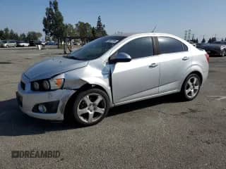 2014 Chevrolet Sonic LTZ с VIN 1G1JE5SG1E4128009, выставлен на аукционе Copart как лот 54007785 с пробегом 146 811 миль миль и Списание • Salvage title. История ставок и продаж доступна на DreamBid. Изображение 1.