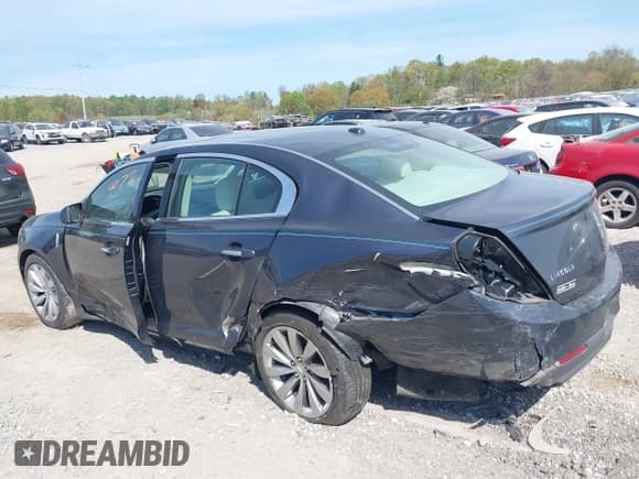 ✅ 2014 Lincoln MKS • VIN: 1LNHL9EK1EG606152 • Lot: 42104079. Listed on IAAI with 165,034 mi. Free auction sales archive from the USA and detailed vehicle history report at DreamBid. Image 3.