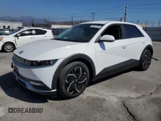 ✅ 2024 Hyundai Ioniq 5 SE • VIN: KM8KM4DE9RU307629 • Лот: 84657955. Опубликован ранее на Copart с пробегом 23 093 миль. Бесплатный доступ к архиву аукционных продаж из США и подробный отчёт об истории автомобиля на DreamBid. Изображение 1.