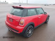 ✅ 2007 MINI Hardtop S • VIN: WMWMF73507TT84271 • Lot: 43763274. Listed on IAAI with 86,360 mi. Free auction sales archive from the USA and detailed vehicle history report at DreamBid. Image 4.