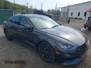 2021 Hyundai Sonata N Line z VIN 5NPEK4JC5MH108963, wystawiony jako IAAI lot #43195113 z przebiegiem 101 460 mil mil oraz . Historia ofert i sprzedaży dostępna na DreamBid. Obrazek 1.