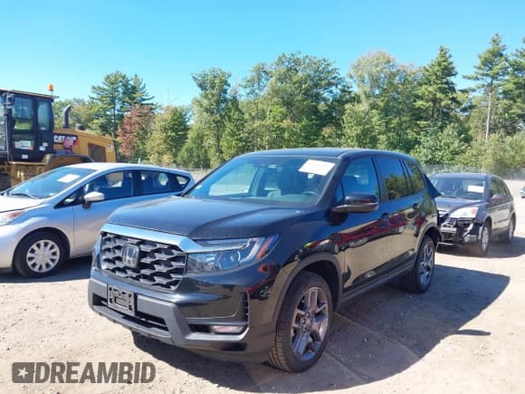 ✅ 2023 Honda Passport EX-L • VIN: 5FNYF8H54PB013071 • Lot: 43246503. Listed on IAAI with 35,120 mi. Free auction sales archive from the USA and detailed vehicle history report at DreamBid. Image 2.