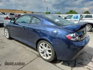 ✅ 2008 Hyundai Tiburon GT • VIN: KMHHN66F78U288604 • Лот: 70559655. Опубликован ранее на Copart с пробегом 92 082 миль. Бесплатный доступ к архиву аукционных продаж из США и подробный отчёт об истории автомобиля на DreamBid. Изображение 2.