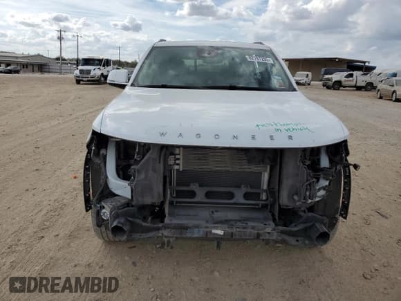 ✅ 2022 Jeep Wagoneer Series III • VIN: 1C4SJVDTXNS102487 • Lot: 82787205. Listed on Copart with 99,353 mi. Free auction sales archive from the USA and detailed vehicle history report at DreamBid. Image 5.