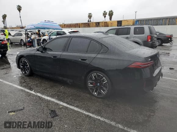 ✅ 2024 BMW i5 M60 • VIN: WBY43FK06RCR21920 • Lot: 43002445. Listed on Copart with 26,452 mi. Free auction sales archive from the USA and detailed vehicle history report at DreamBid. Image 2.
