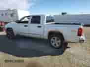 2010 Dodge Dakota Laramie z VIN 1D7CW5GP3AS140020, wystawiony jako Copart lot #76813194 z przebiegiem Nie podano mil oraz Szkoda całkowita • Salvage title. Historia ofert i sprzedaży dostępna na DreamBid. Obrazek 2.