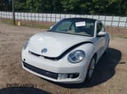 ✅ 2014 Volkswagen Beetle 2.0L TDI w/Sun/Sound/Nav • VIN: 3VWJL7AT1EM661941 • Лот: 42616355. Опубликован ранее на IAAI с пробегом 76 091 миль. Бесплатный доступ к архиву аукционных продаж из США и подробный отчёт об истории автомобиля на DreamBid. Изображение 6.