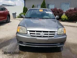 2005 Hyundai Accent GLS z VIN KMHCG45C45U645068, wystawiony jako Copart lot #63000715 z przebiegiem 205 762 mil mil oraz Nie do naprawy • Non repairable. Historia ofert i sprzedaży dostępna na DreamBid. Obrazek 5.