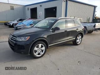 ✅ 2013 Volkswagen Touareg Lux • VIN: WVGEF9BP4DD005165 • Lot: 64056895. Listed on Copart with 125,152 mi. Free auction sales archive from the USA and detailed vehicle history report at DreamBid. Image 1.