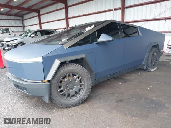 ✅ 2024 Tesla Cybertruck • VIN: 7G2CEHED7RA011398 • Lot: 43562352. Listed on IAAI with 37,155 mi. Free auction sales archive from the USA and detailed vehicle history report at DreamBid. Image 2.