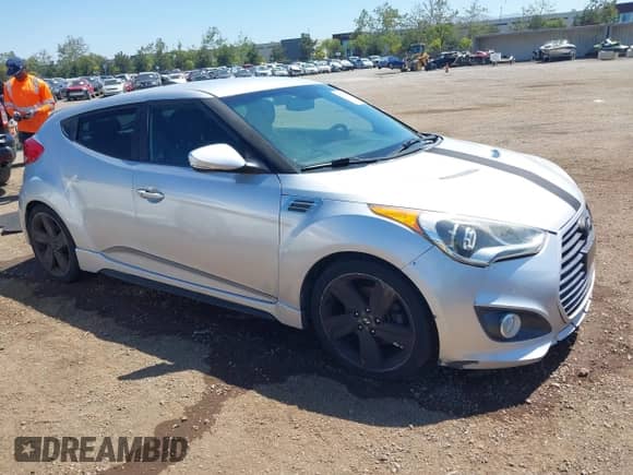 2013 Hyundai Veloster Turbo с VIN KMHTC6AE2DU147433, выставлен на аукционе IAAI как лот 42239672 с пробегом 130 640 миль миль и . История ставок и продаж доступна на DreamBid. Изображение 1.
