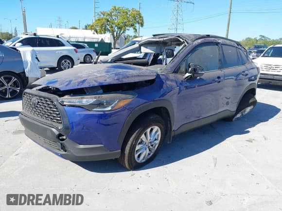 ✅ 2023 Toyota Corolla Cross LE • VIN: 7MUBAAAGXPV068892 • Lot: 41734428. Listed on IAAI with 12,790 mi. Free auction sales archive from the USA and detailed vehicle history report at DreamBid. Image 2.