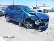 ✅ 2022 Mazda CX-5 S Carbon Edition • VIN: JM3KFBCM4N0584354 • Lot: 42817467. Listed on IAAI with 57,528 mi. Free auction sales archive from the USA and detailed vehicle history report at DreamBid. Image 1.