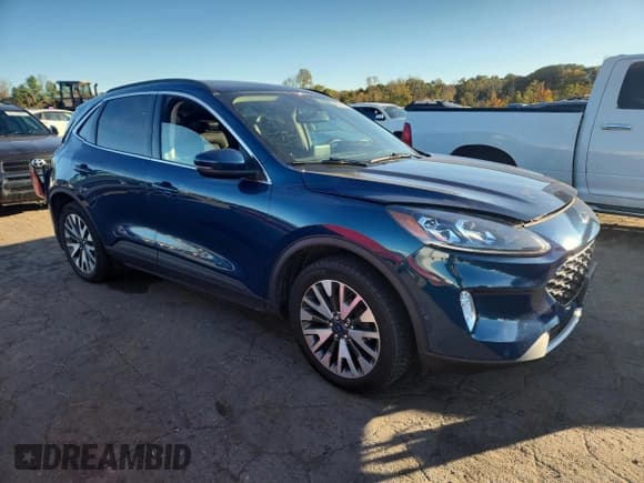 ✅ 2020 Ford Escape Titanium • VIN: 1FMCU9J98LUA20511 • Lot: 86096125. Listed on Copart with 54,496 mi. Free auction sales archive from the USA and detailed vehicle history report at DreamBid. Image 4.