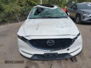 ✅ 2021 Mazda CX-5 Touring • VIN: JM3KFBCM7M0477474 • Lot: 43434996. Listed on IAAI with 76,683 mi. Free auction sales archive from the USA and detailed vehicle history report at DreamBid. Image 12.