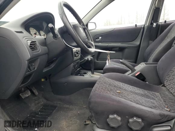 ✅ 2001 Mazda Protege LX • VIN: JM1BJ226510402231 • Lot: 46717595. Wystawiony na Copart z przebiegiem 154 138 mil. Bezpłatny archiwum sprzedaży aukcyjnych z USA i szczegółowy raport historii pojazdu na DreamBid. Zdjęcie 7.