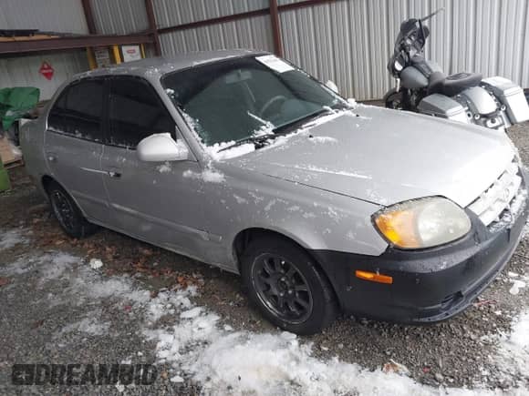 2005 Hyundai Accent GLS with VIN KMHCG45C75U656548, listed as a IAAI auction lot 41553603 with 178,070 mi miles and . Bid and sale history available at DreamBid. Image 1.