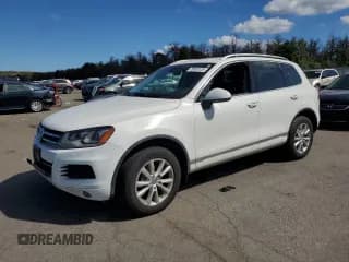 ✅ 2013 Volkswagen Touareg Sport • VIN: WVGEF9BP7DD013180 • Lot: 70563125. Listed on Copart with 184,027 mi. Free auction sales archive from the USA and detailed vehicle history report at DreamBid. Image 1.