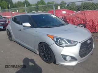 2014 Hyundai Veloster Turbo z VIN KMHTC6AE8EU211248, wystawiony jako IAAI lot #43078232 z przebiegiem 184 148 mil mil oraz . Historia ofert i sprzedaży dostępna na DreamBid. Obrazek 1.