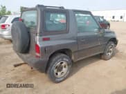 ✅ 1997 Geo Tracker • VIN: 2CNBJ1863V6906951 • Lot: 42400087. Listed on IAAI with 209,563 mi. Free auction sales archive from the USA and detailed vehicle history report at DreamBid. Image 4.