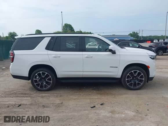 2023 Chevrolet Tahoe RST z VIN 1GNSKRKD7PR506168, wystawiony jako IAAI lot #42833878 z przebiegiem Nie podano mil oraz . Historia ofert i sprzedaży dostępna na DreamBid. Obrazek 12.