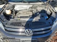 ✅ 2013 Volkswagen Tiguan S • VIN: WVGBV3AXXDW585174 • Lot: 93643875. Listed on Copart with 143,089 mi. Free auction sales archive from the USA and detailed vehicle history report at DreamBid. Image 12.