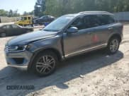 ✅ 2016 Volkswagen Touareg Sport • VIN: WVGEF9BP1GD012594 • Lot: 52438305. Listed on Copart with 125,204 mi. Free auction sales archive from the USA and detailed vehicle history report at DreamBid. Image 1.