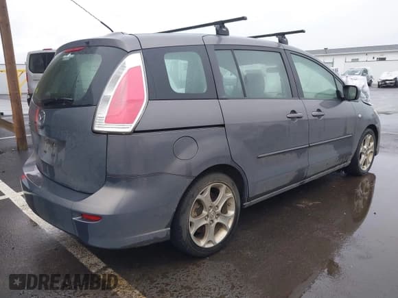 ✅ 2009 Mazda 5 Touring • VIN: JM1CR29L690356302 • Lot: 41573737. Listed on IAAI with 127,276 mi. Free auction sales archive from the USA and detailed vehicle history report at DreamBid. Image 4.
