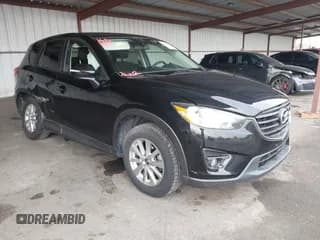 ✅ 2016 Mazda CX-5 Touring • VIN: JM3KE4CY7G0779756 • Lot: 43315347. Wystawiony na IAAI z przebiegiem 78 136 mil. Bezpłatny archiwum sprzedaży aukcyjnych z USA i szczegółowy raport historii pojazdu na DreamBid. Zdjęcie 1.