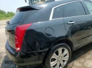 ✅ 2015 Cadillac SRX Premium Collection • VIN: 3GYFNGE3XFS573121 • Lot: 64599105. Wystawiony na Copart z przebiegiem 105 369 mil. Bezpłatny archiwum sprzedaży aukcyjnych z USA i szczegółowy raport historii pojazdu na DreamBid. Zdjęcie 14.